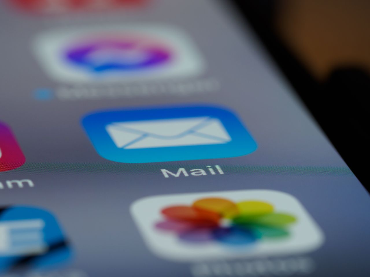 creative-02 Detailed close-up of an email app icon on a smartphone screen, showcasing modern technology.